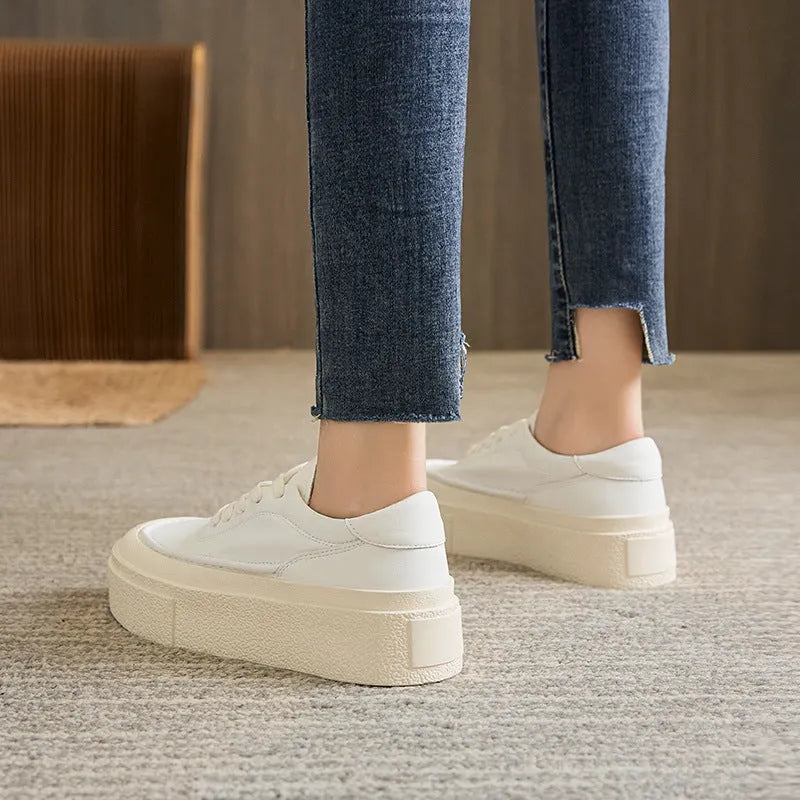 Women's black embossed cowhide platform sports board shoes with a rubber sole.