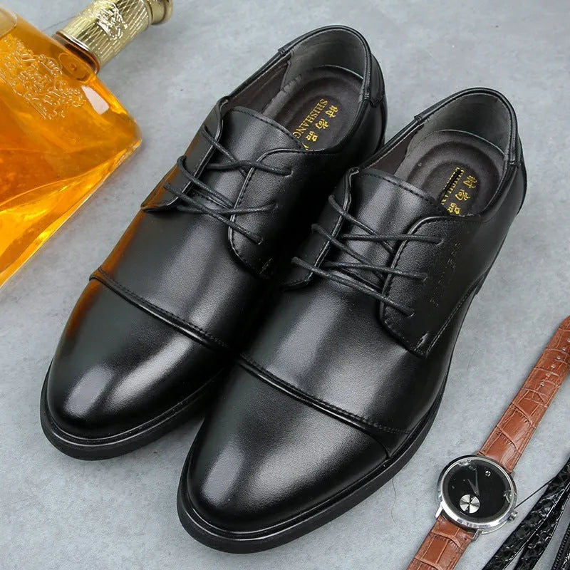 Men's black formal lace-up shoe with decorative stitching and a horse buckle on a rubber sole.