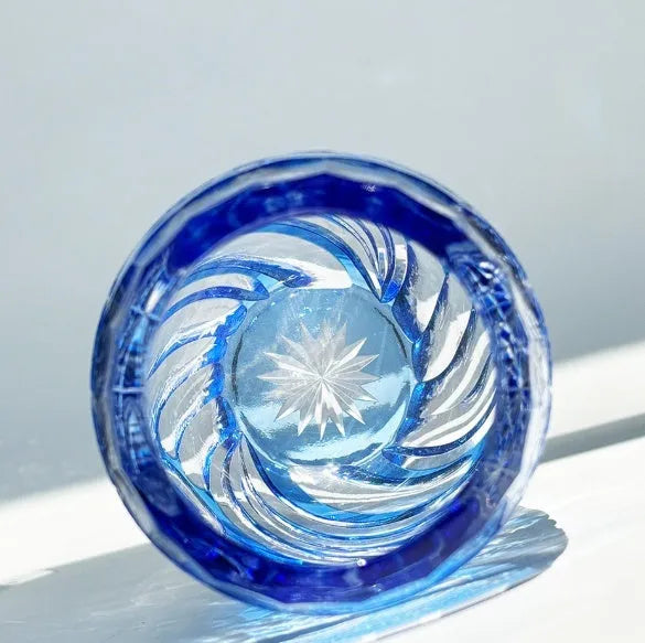 Blue Jianghu cut crystal glass tumbler 80x190mm on a wooden surface