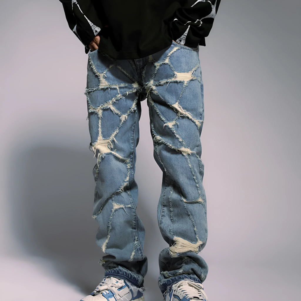 High street wash destroyed spider web straight leg jeans in light blue denim, mid-waist zipper front