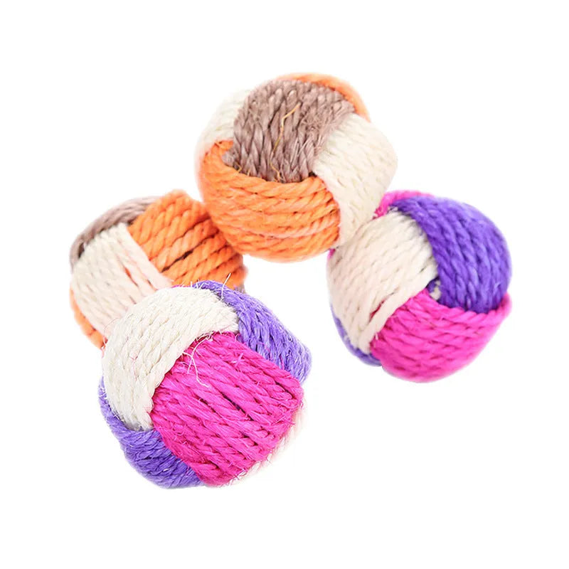Natural sisal cat toy ball 6cm diameter for biting play on white background