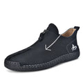 Men's black leather martin boots with a front metal zipper and round toe on a rubber sole.