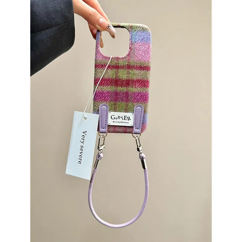Flannel plaid phone case with wristband in black green and red checkered, compatible with iPhone models.