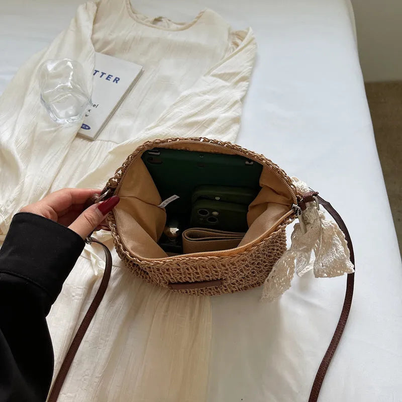 Women's woven straw shoulder messenger bag in khaki with zip pocket and single strap.