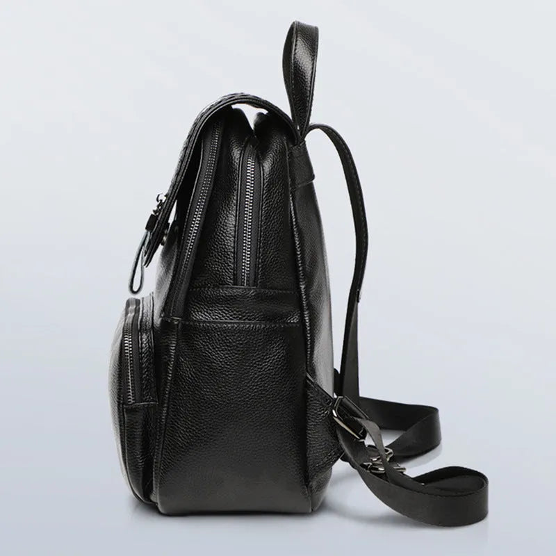 Genuine leather blue women's backpack showing front sandwich pocket and street trend design.