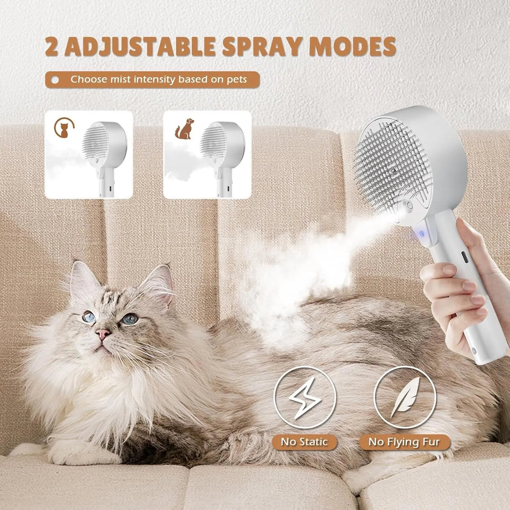 Pink and white cat grooming brush with water tank, stainless steel bristles, and mist spray function