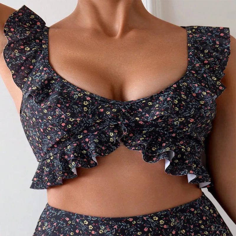 Women's floral flounce split backless swimsuit set in polyester on black background