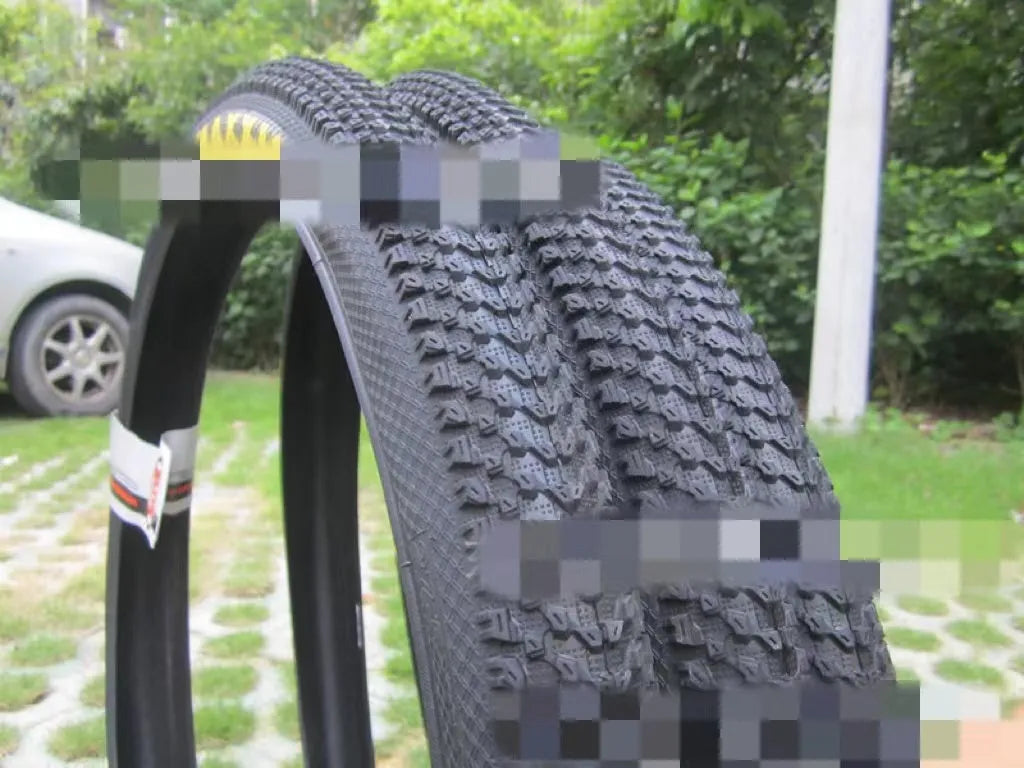 Ultralight puncture-proof mountain bike tyre showing tread pattern, available for 26, 27.5 and 29 inch wheels