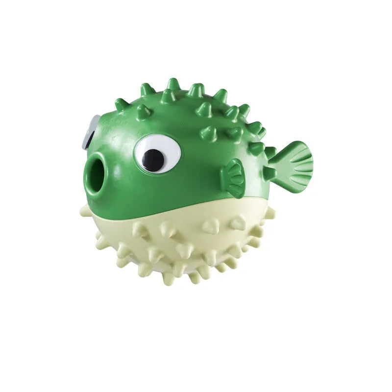 Green fish-shaped interactive dog toy with textured surface and treat dispensing opening