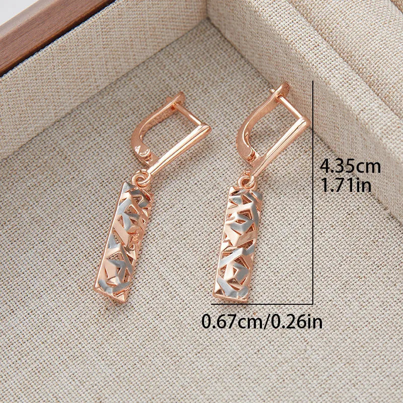 Rectangular two-tone hollow alloy stud earrings for women with electroplated finish.