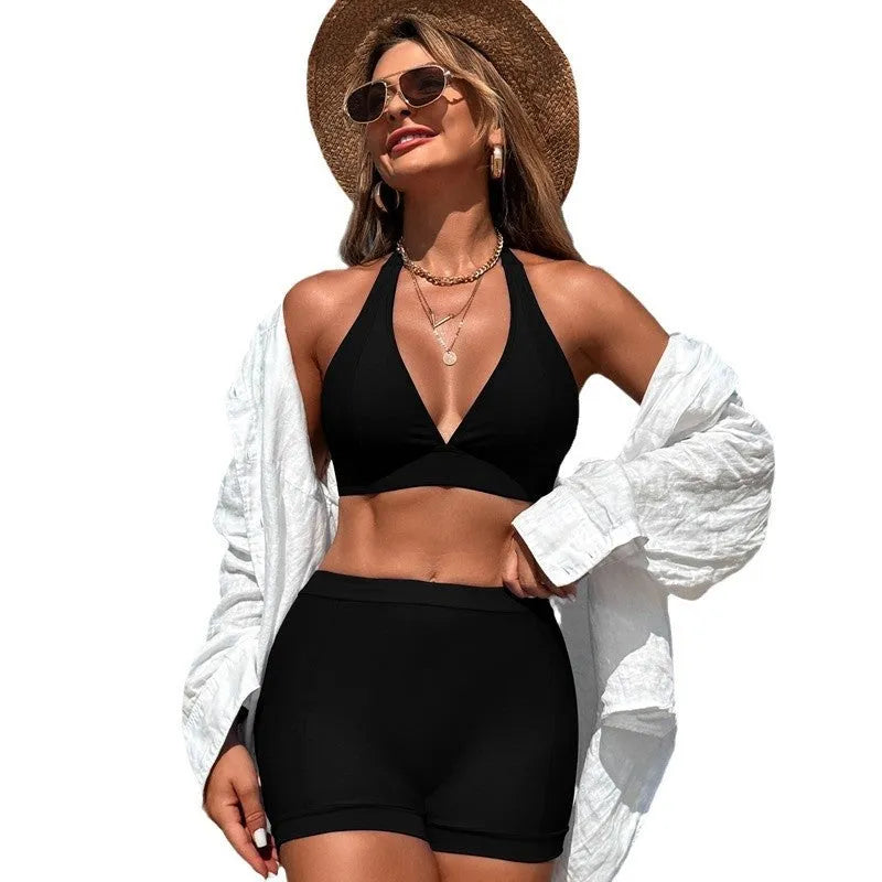 Women's black nylon bikini swimsuit on a hanger with other colour options shown.