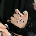 Black pink heart hand-painted artificial nails with bow patterns and cat's eye finish
