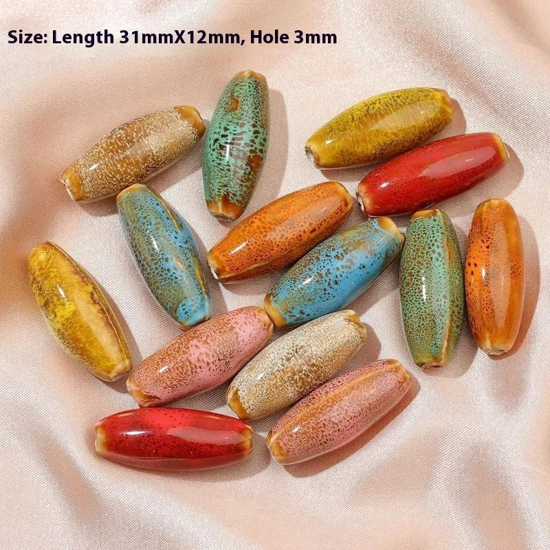 Ceramic bullet beads for jewellery making in eight glaze colours including pink, yellow, blue, red, coffee, green, orange, and mixed