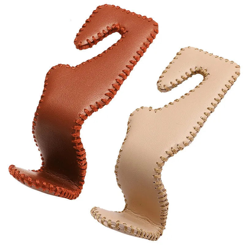 Stainless steel car seat back hook with gold finish and leather strap for vehicle interior organisation