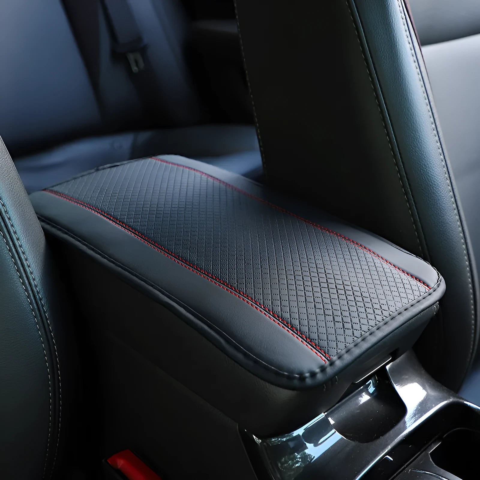 PU leather automotive armrest box cushion measuring 32x19cm in black with red cord detailing