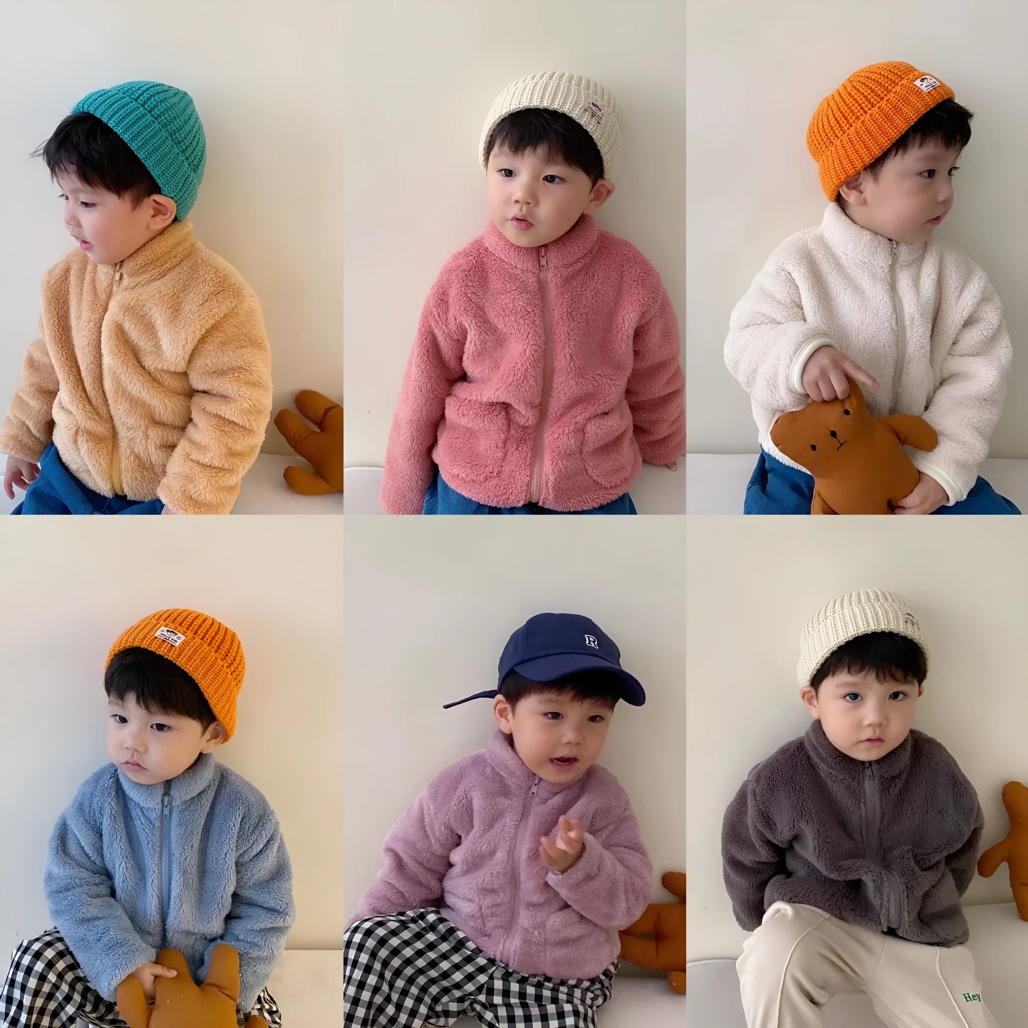 A child's blue sherpa fleece jacket with a full zip, high collar, and front pockets on a hanger.