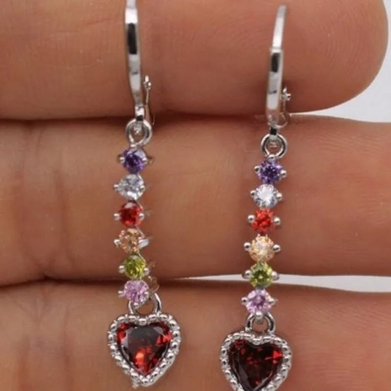 Pair of women's heart-shaped alloy earrings with electroplated gold or silver finish.
