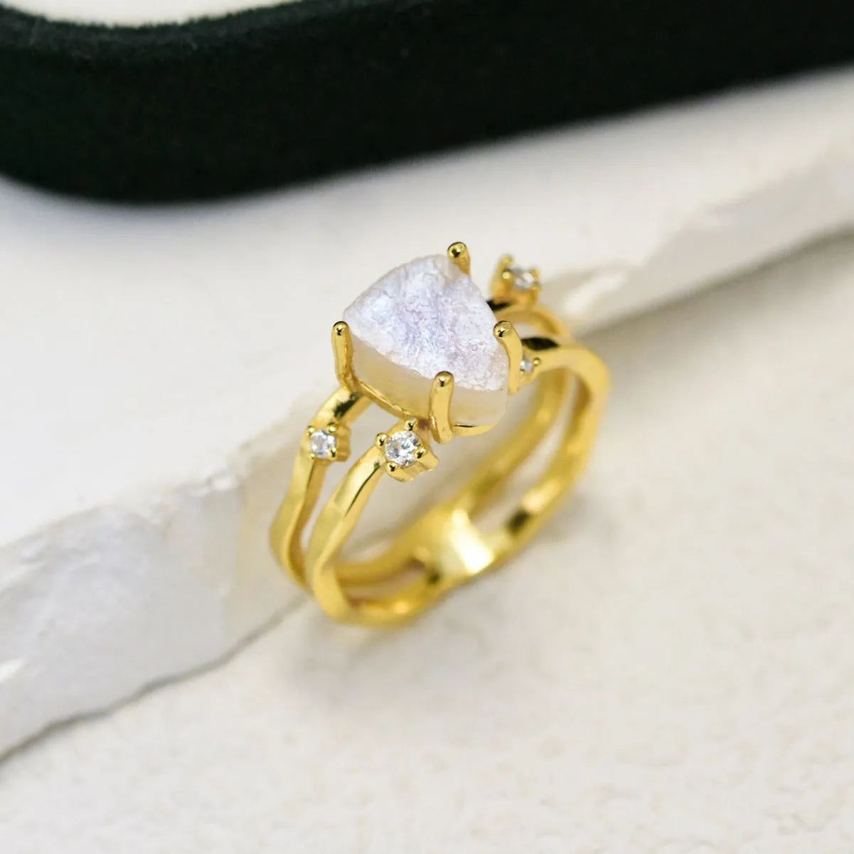 S925 sterling silver geometric ring with an irregular triangle moonstone in a choice of rose gold, white gold, or yellow gold finish.
