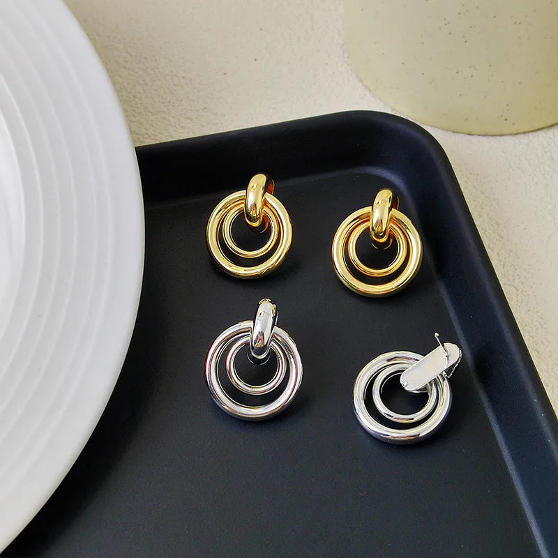 Geometric round ring earrings with irregular design in gold electroplated finish