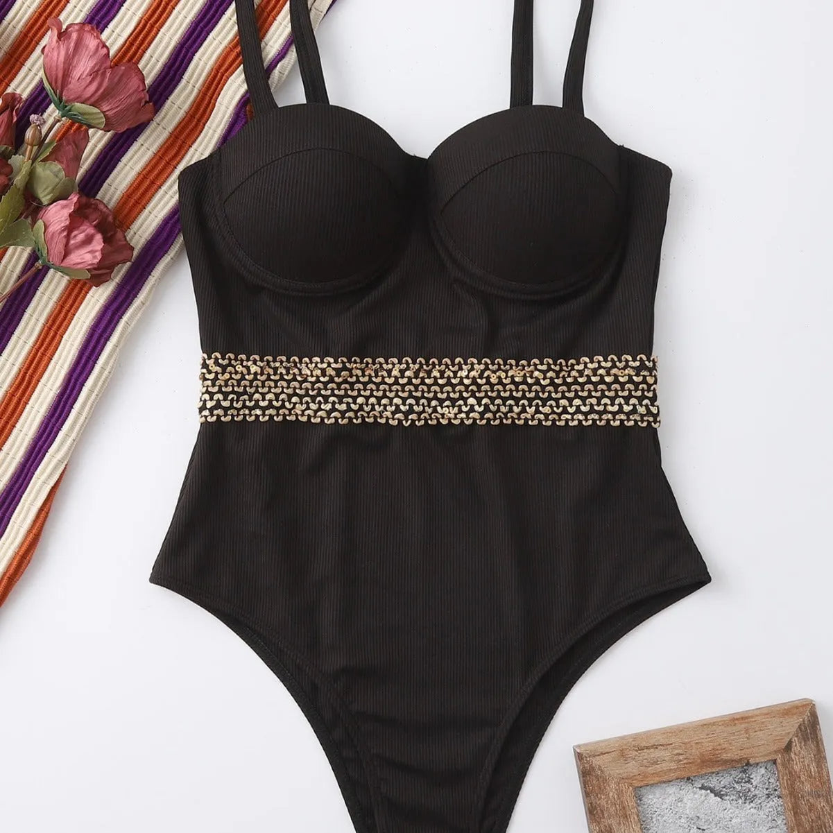 Black women's one-piece swimsuit with a matching hard storage bag that has an adjustable shoulder strap.