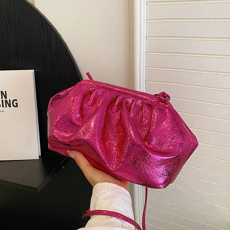 Shell-shaped crossbody bag with hair clip attachment in multiple colour options showing organised internal compartments