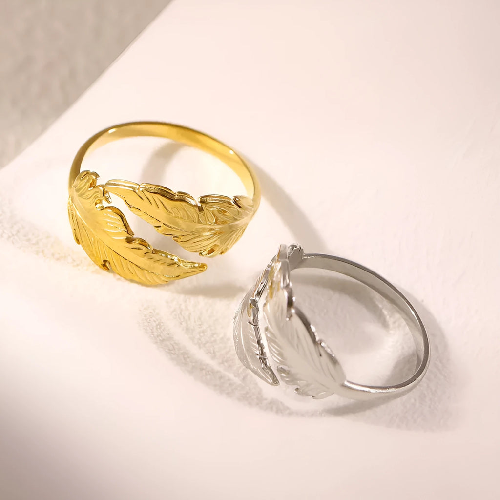 Adjustable titanium steel feather ring with silver electroplated finish on female hand
