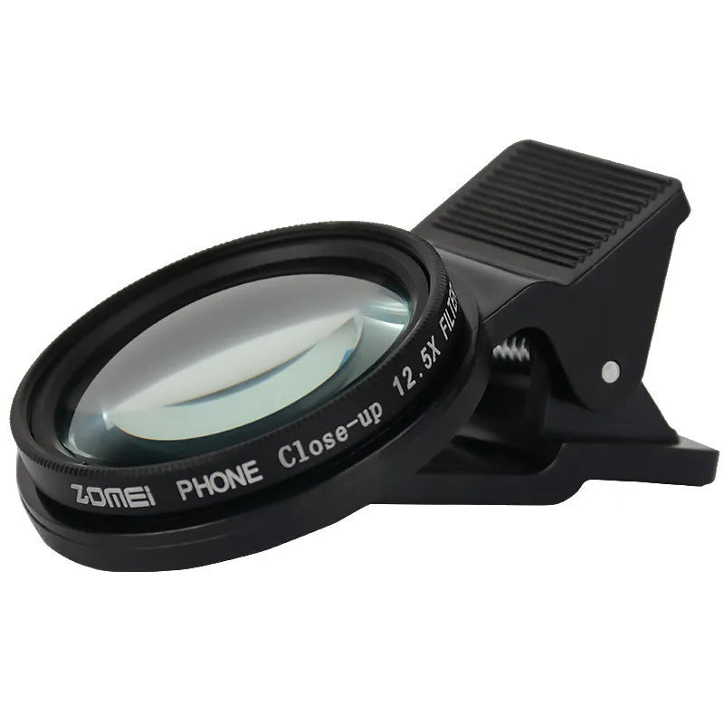 Smartphone macro close-up lens with aluminium frame and clip attachment on white background.