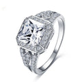 Geometric hollow design women's zircon ring in platinum finish on copper, showing quadrilateral stone.