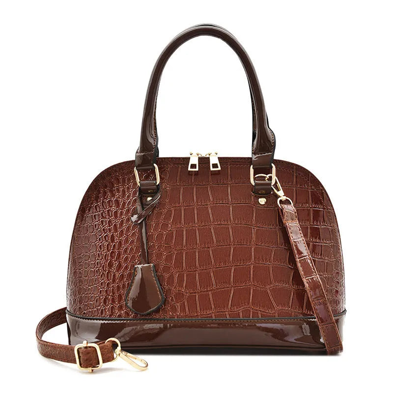 Shiny PU leather crossbody shoulder bag with shell-shaped design in black, red, or brown