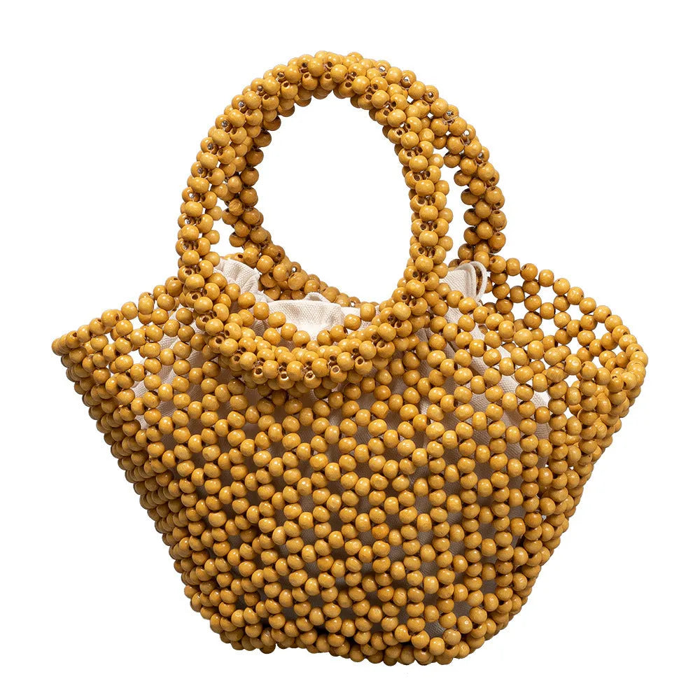 Hand-woven maple wooden bead beach bag in dumpling shape with hollow weave design