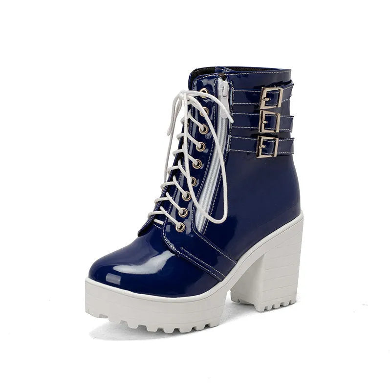 Women's black thick-heeled short boots with lace-up front and round toe on a rubber sole.