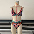 Women's floral print high-waist bikini swimsuit set on a mannequin.