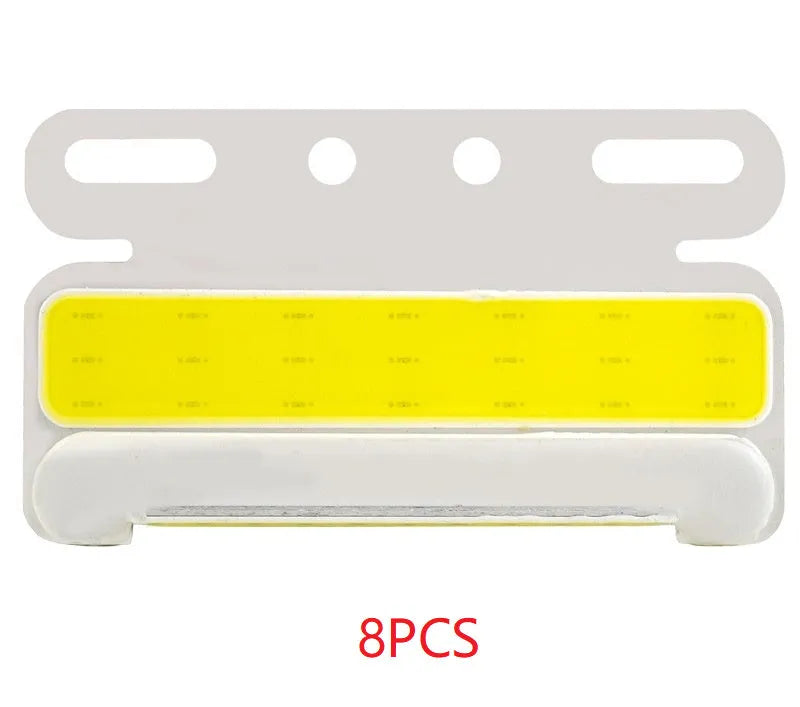 Waterproof aluminium alloy COB LED ground tyre light for trucks in 12v or 24v, shown in available colours.