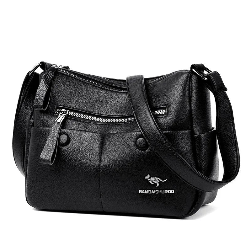 Soft PU leather crossbody shoulder bag in horizontal square shape with stitching details and multiple compartments