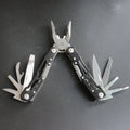 All steel multi-function pliers in black and silver grey with 14-in-one functions, 420 steel body, and 15.6cm developed length