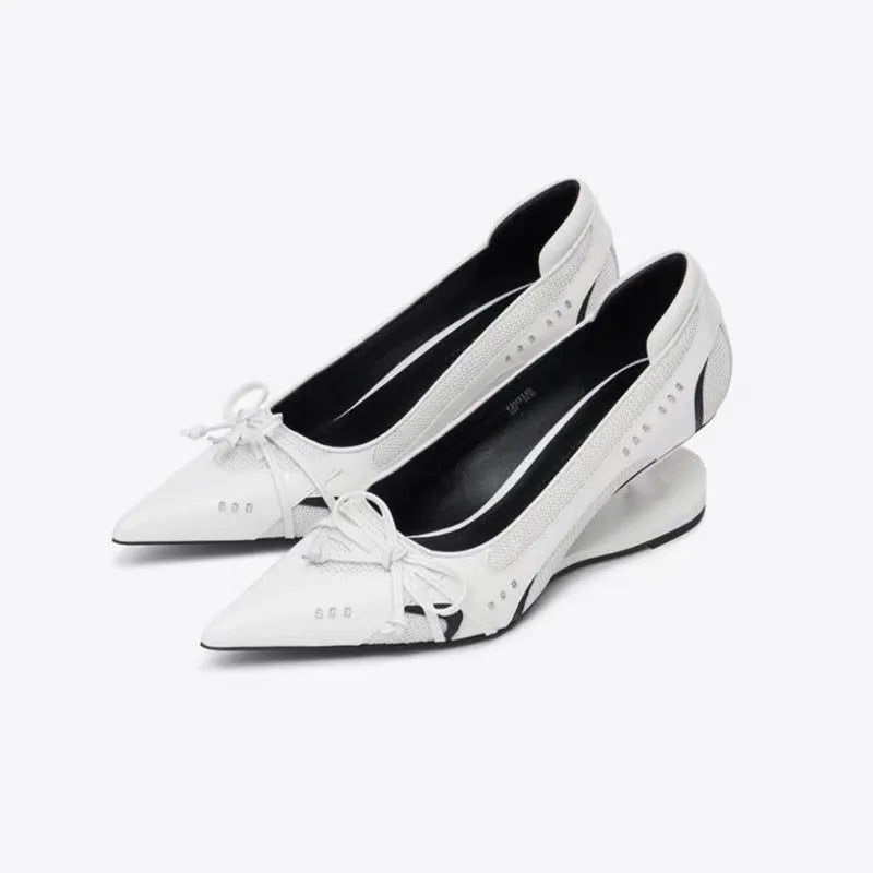 Black women's pointed toe Mary Jane shoes with a distinctive floating shaped heel and slip-on strap.