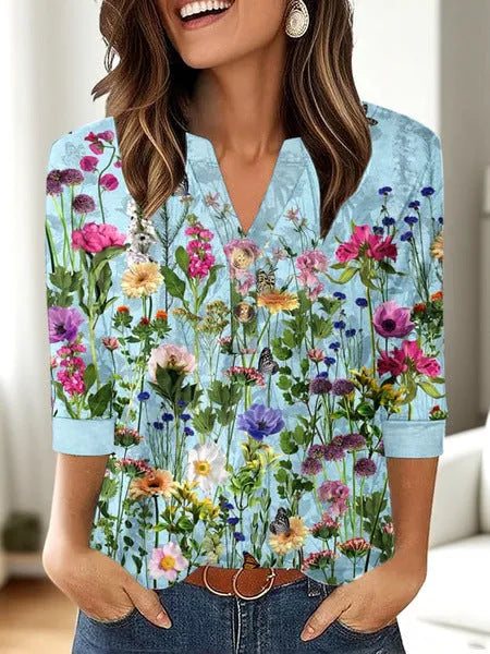 Women's loose-fit casual V-neck top with a 3D printed pattern, available in multiple colours.
