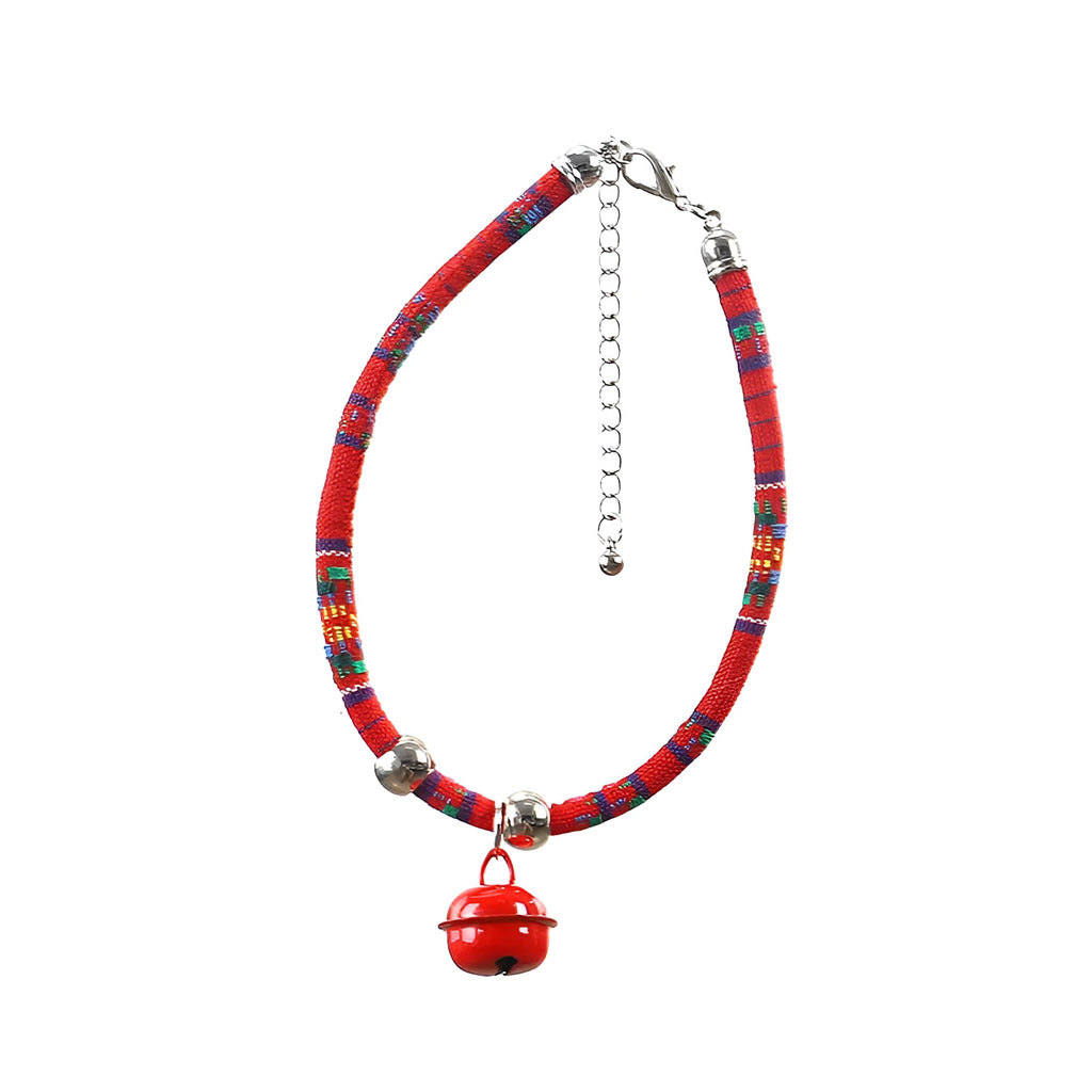 Coloured ethnic pattern adjustable pet collar with metal bell and D-ring on a nylon strap.