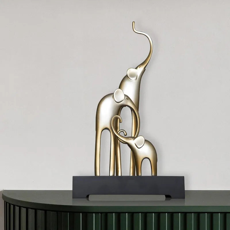 Fortune Bring Elephant decorative resin statue in gold on a wooden shelf.