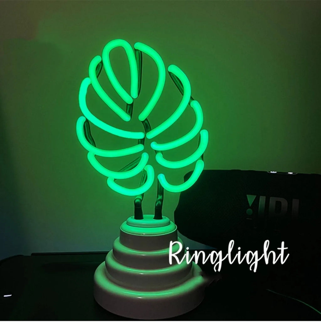 Minimalist bamboo-shaped desktop lamp with USB cable and green illumination