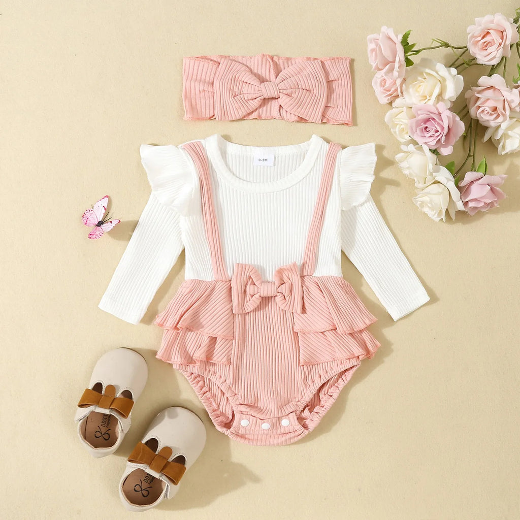 Baby girls cotton romper with flounced shoulder strap and long sleeves in pink, triangle jumpsuit style