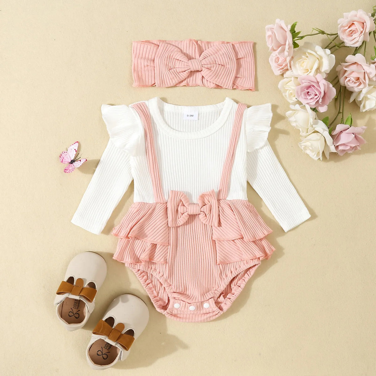 Baby girls cotton romper with flounced shoulder strap and long sleeves in pink, triangle jumpsuit style