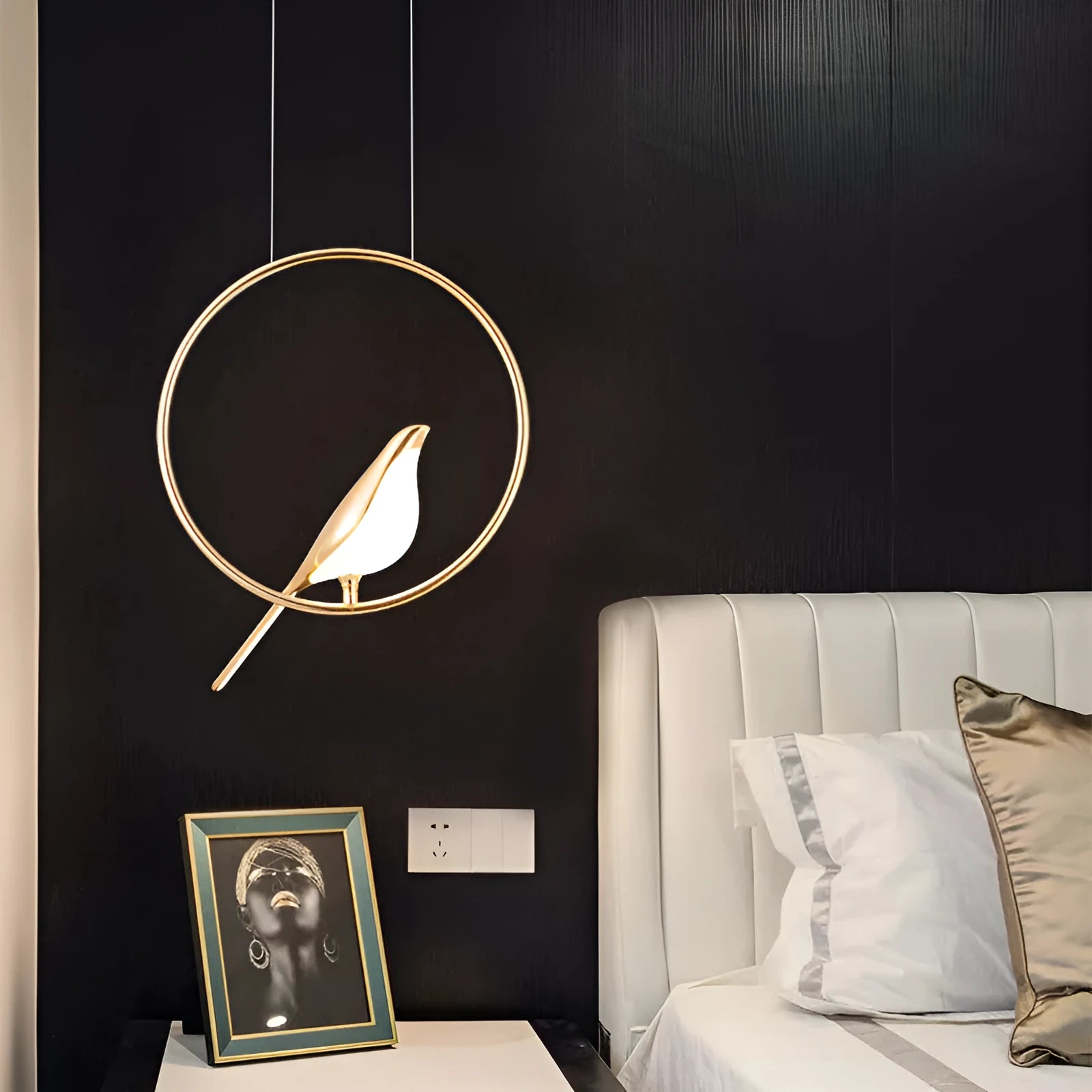 Modern minimalist magpie bird silhouette chandelier light fitting with a long drop.