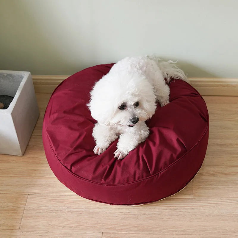 Round plush pet bed for small and medium dogs and cats, 60-80cm diameter, beige or grey, with raised rim.
