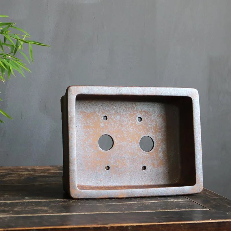 Rectangular purple sand bonsai pot with firewood burning finish and five-line basin design.