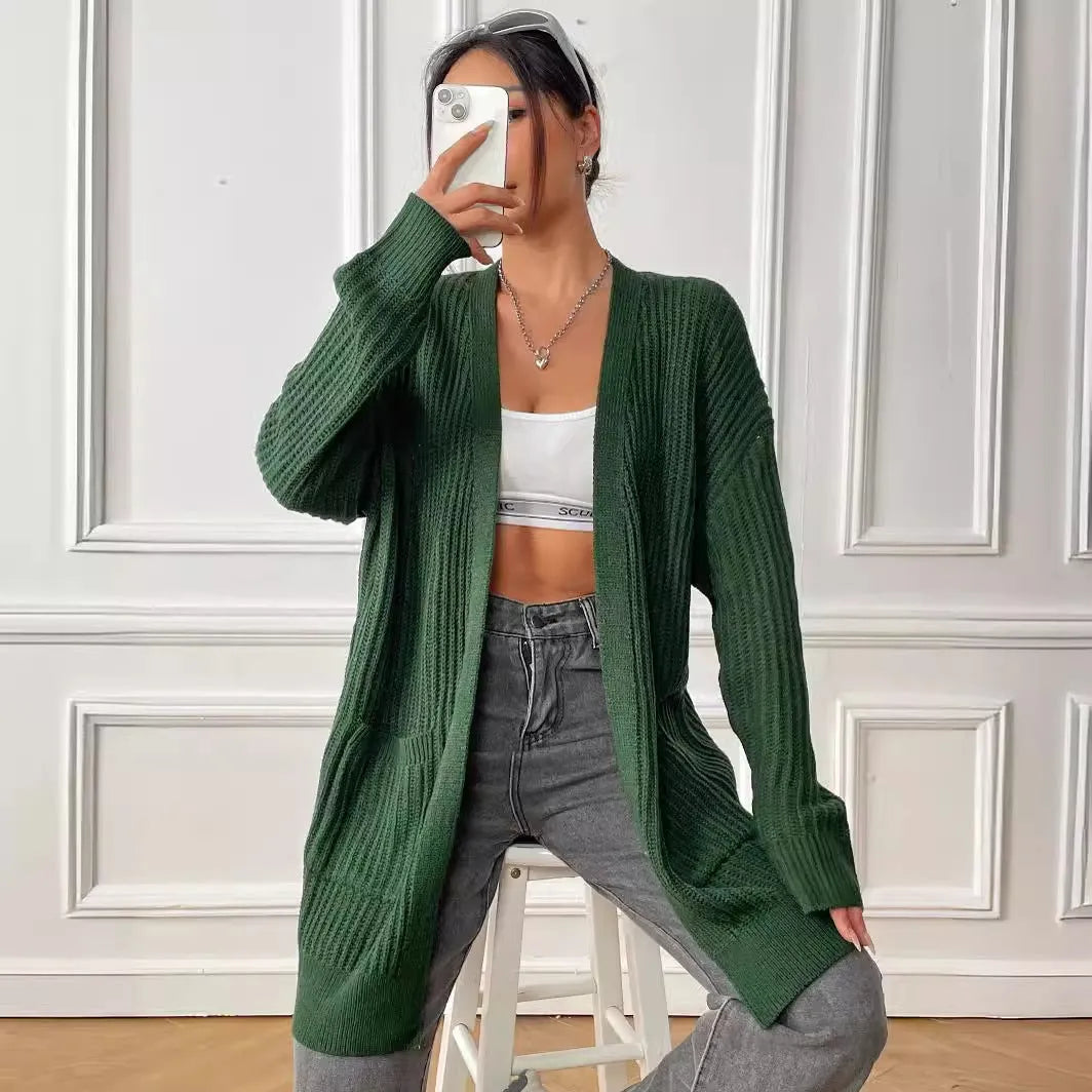 Women's loose fit acrylic cardigan with double pockets in dark green colour showing mid-length design