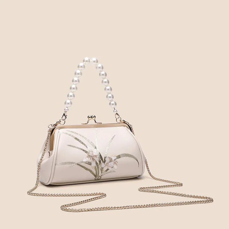Beige women's embroidered shoulder bag in soft PU leather with shell-shaped design