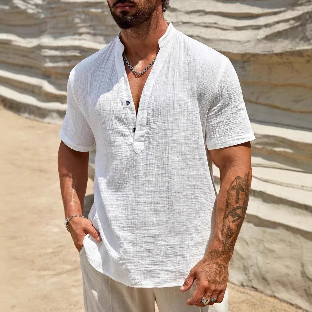 Men's solid colour stand collar short-sleeved casual shirt laid flat, showing thin fabric and slit detail.