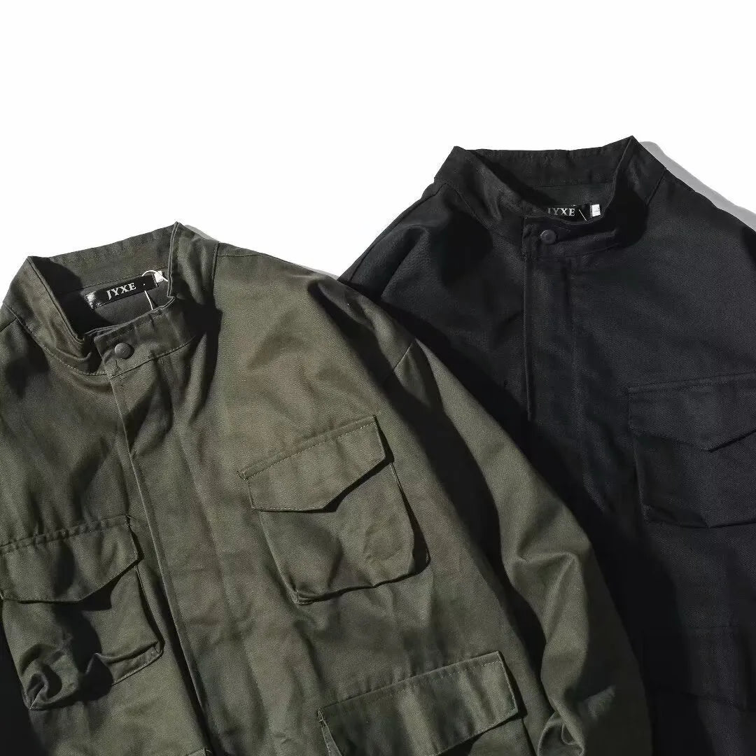 Men's multi-pocket workwear jacket in black or green, loose fit, long sleeve, sizes M to 3XL