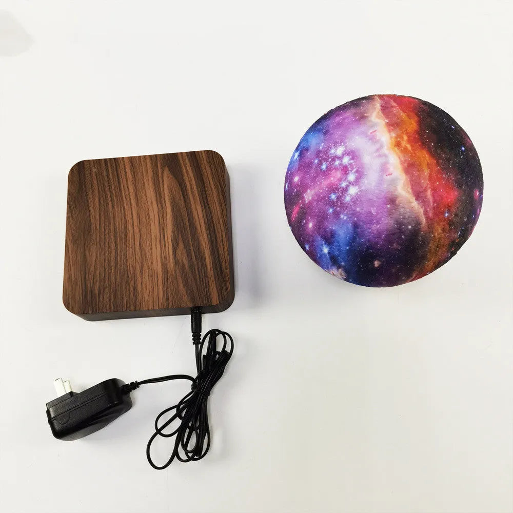 14cm magnetic levitation galaxy moon lamp floating above square walnut colour base